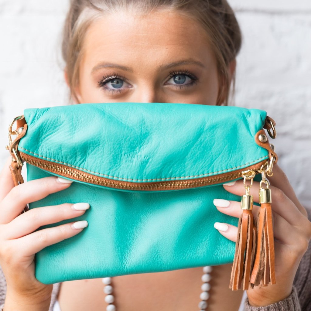 Turquoise and tan leather handbag