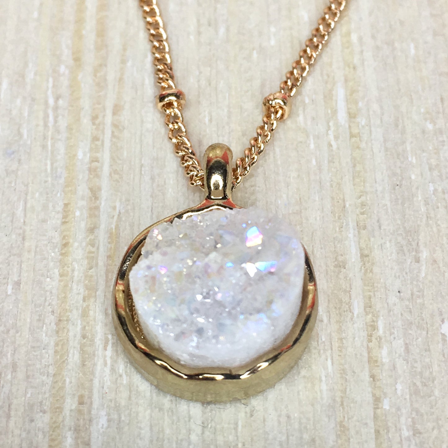 close up of white druzy pendant necklace