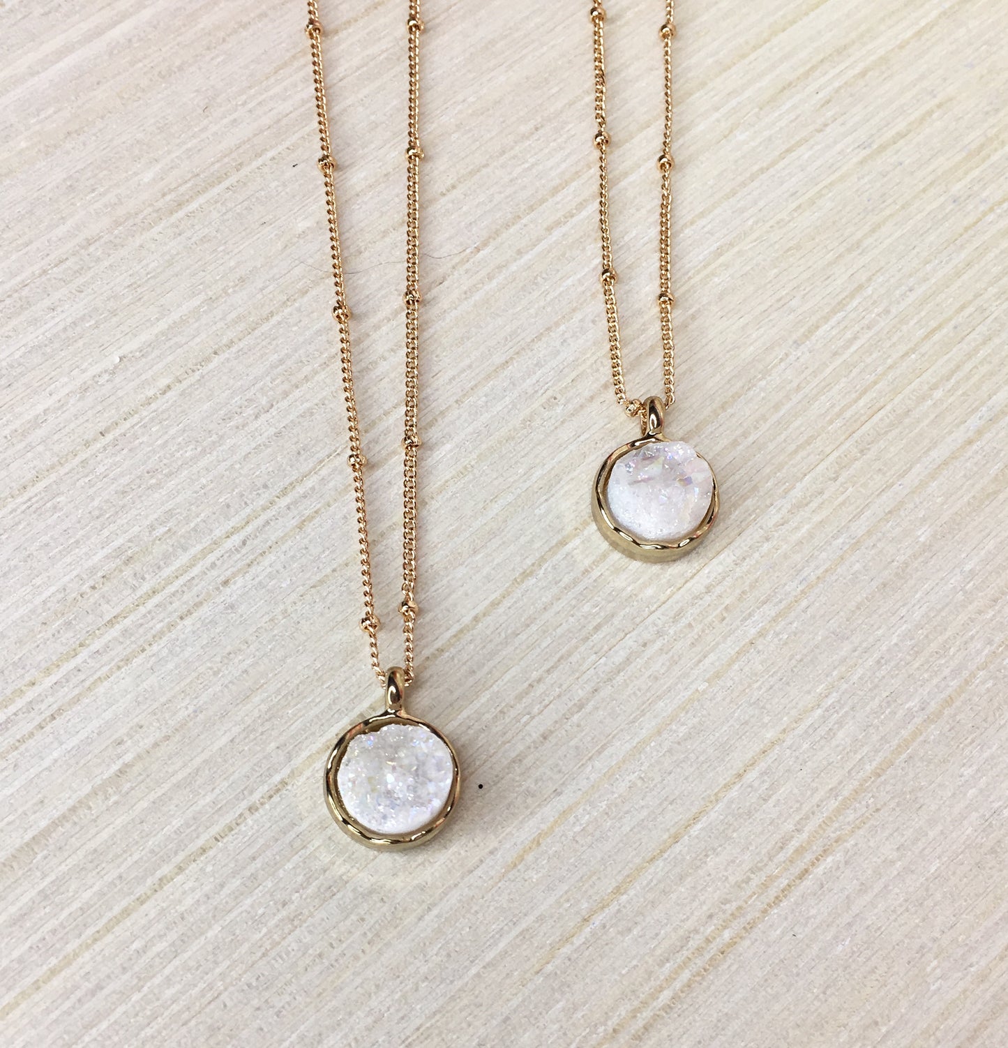 white druzy necklaces on gold beaded chain