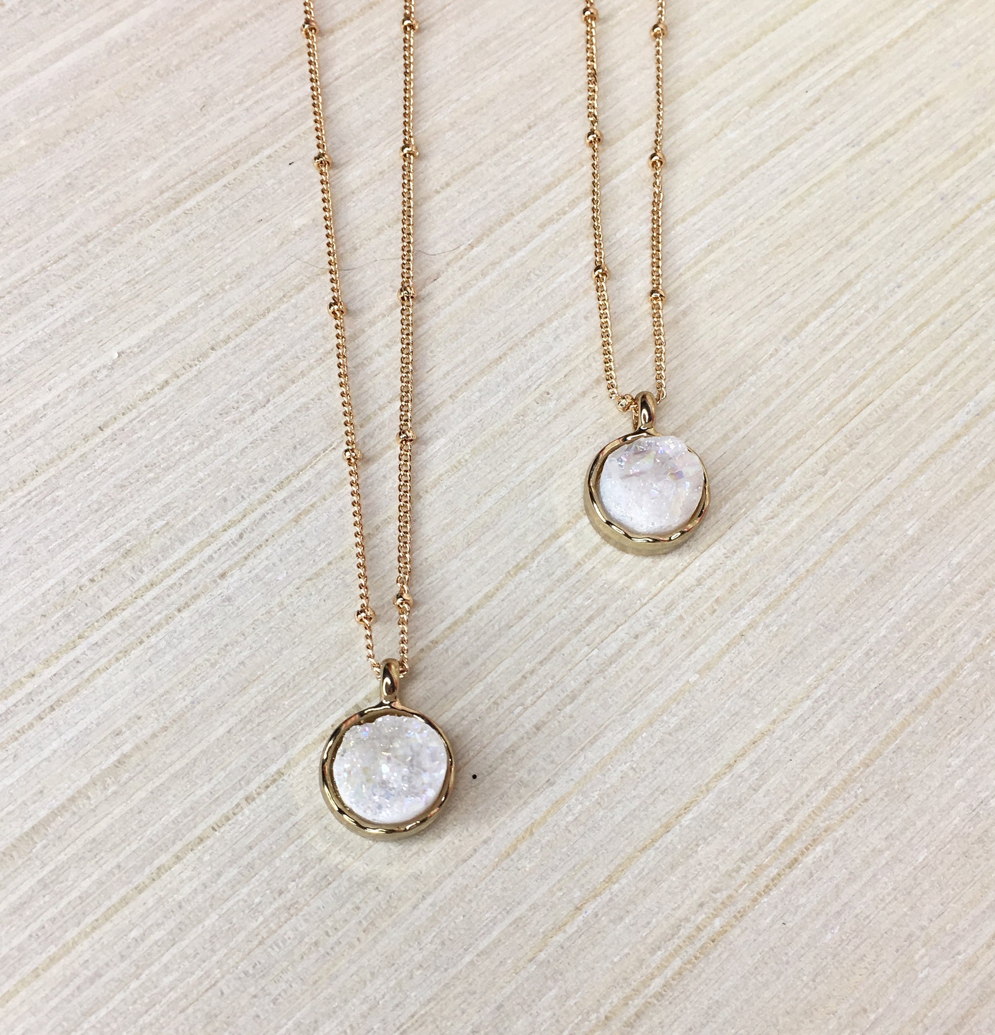 white druzy necklaces on gold beaded chain